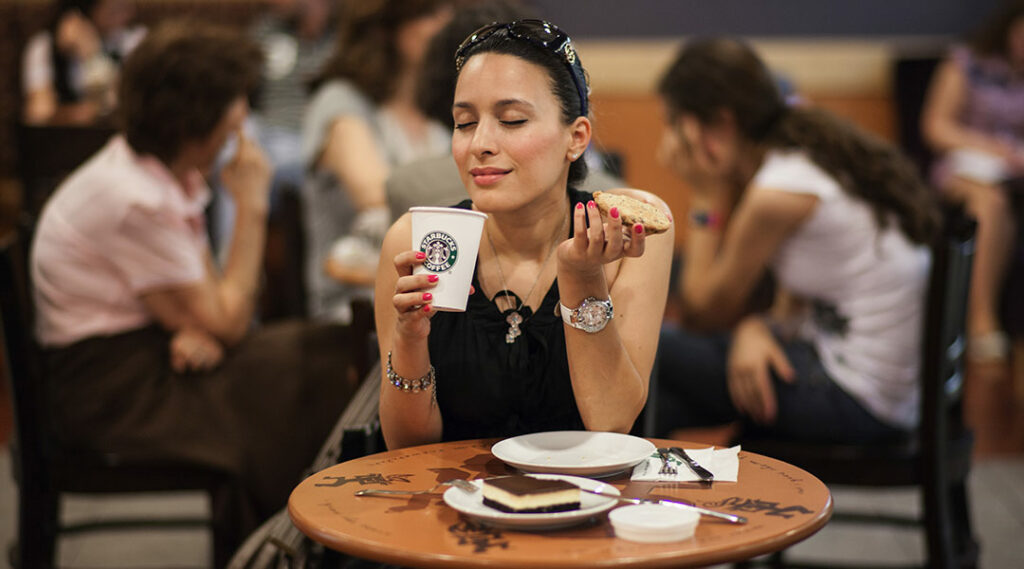 Girl drinking coffee in Starbucks