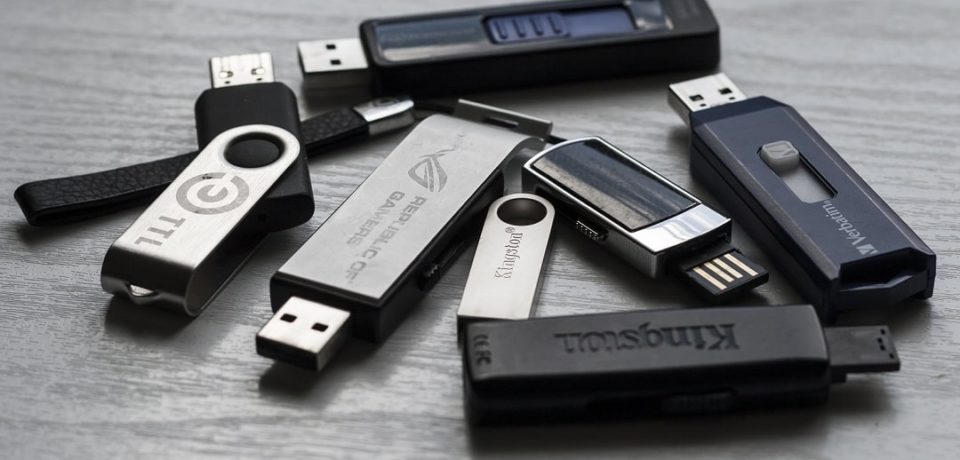 Black USB sticks on a table