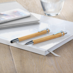 Ecological set with bamboo ballpoint pen and pencil wood colour ambient view