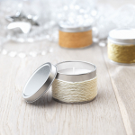 Scented candle in a metal tin for health & wellness promotions white colour ambient view