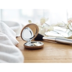 Pocket mirror with normal and magnifying mirror housed in cork ambient view