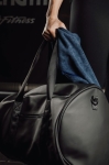 Synthetic leather sports or travel bag with shoulder strap black colour