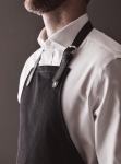Cotton apron with leather-look details and buckle fastening black colour