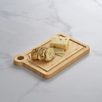 Bamboo chopping board with corner handle for serving natural colour ambient view