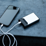 Recycled plastic power bank with fast charging 6,000 mAh black colour ambient view