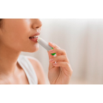 Vegan lip balm with vanilla scent in a transparent case still life view