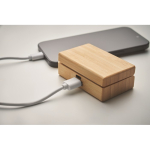 Wireless earphones with microphone in a bamboo case wood colour photographic view