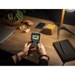 Portable gaming console with 256 classic action and sports games still life view