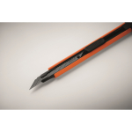 Retractable utility knife with plastic casing and carbon steel blade orange colour fourth photographic view