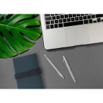 Shiny recycled stainless-steel pen with blue ink still life view