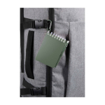 Mini spiral-bound notebook with black ink pen marbled green colour close-up view 1