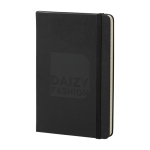 Moleskine Classic medium hard cover notebook, ruled pages black colour close-up view with logo