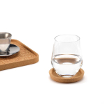 Round cork coaster with raised rim made in Europe natural colour ambient view