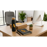Office set with 520ml glass bottle, A5 notebook and blue-ink pen still life view