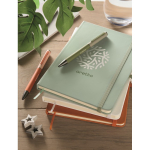 A5 recycled faux leather hard cover notebook, lined pages mint green colour main ambient view