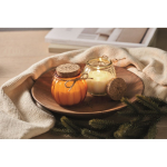 Glass candle holder with cork lid and vanilla scented candle orange colour ambient view