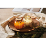 Glass candle holder with cork lid and vanilla scented candle orange colour main ambient view