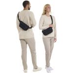 Versatile Thule 2L double-compartment crossbody bag black colour lifestyle image 2