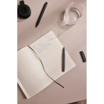 A5 softcover notebook with recycled paper, lined pages green colour ambient view 3 