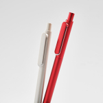 Recycled plastic pen with reinforced clip and blue ink detail view
