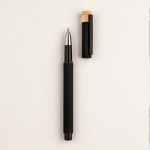 Recycled aluminium and bamboo rollerball pen with blue ink black colour ambient view