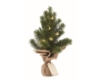 Small plastic Christmas tree as a decoration for the office colour green