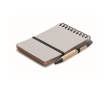 Notebook with blue ink pen and elastic band, lined pages colour grey