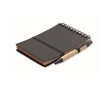 Notebook with blue ink pen and elastic band, lined pages colour dark grey