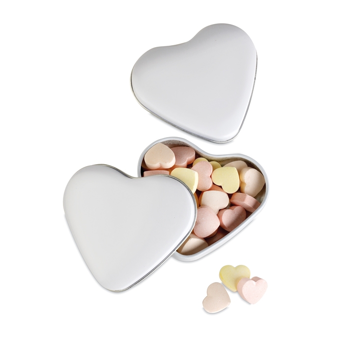 Small heart-shaped metal tin with heart-shaped sweets