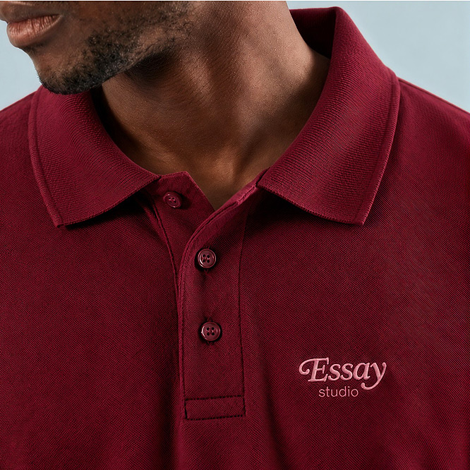 Burgundy polo shirt with an embroidered chest logo