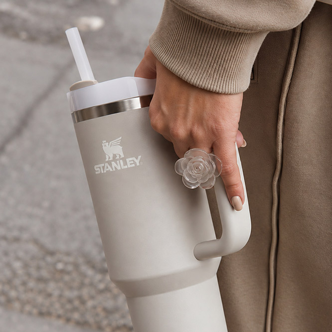 Cream Stanley tumbler with a handle and straw